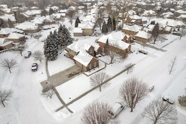 snowy aerial view featuring a residential view