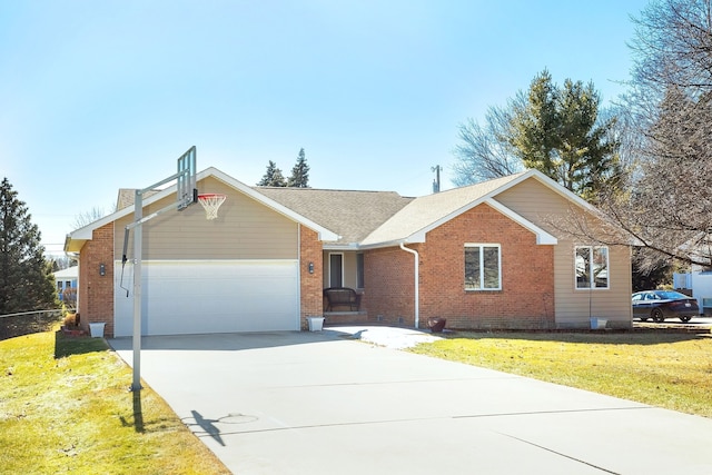 ranch-style house with driveway, brick siding, an attached garage, and a front yard