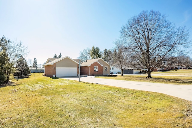 ranch-style house with brick siding, driveway, an attached garage, and a front yard