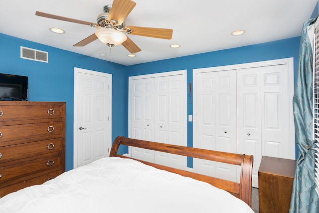 bedroom featuring recessed lighting, visible vents, multiple closets, and ceiling fan