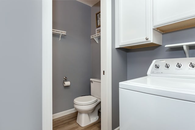 laundry area featuring laundry area, washer / clothes dryer, wood finished floors, and baseboards