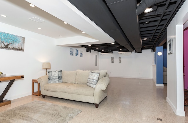 living area featuring recessed lighting, speckled floor, baseboards, and visible vents