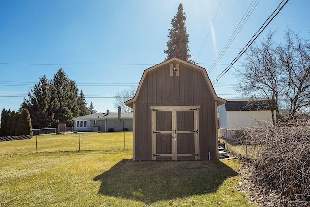 view of shed featuring fence