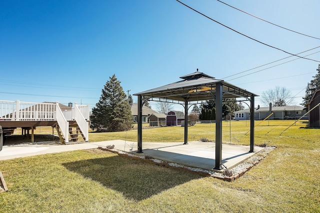 view of yard featuring a gazebo, stairway, and a wooden deck