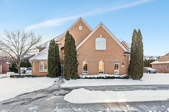 view of front of house featuring brick siding