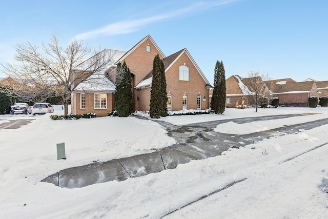 traditional-style house featuring brick siding