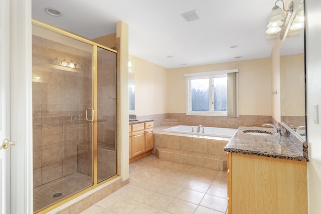 bathroom featuring visible vents, tile patterned flooring, vanity, a shower stall, and a bath