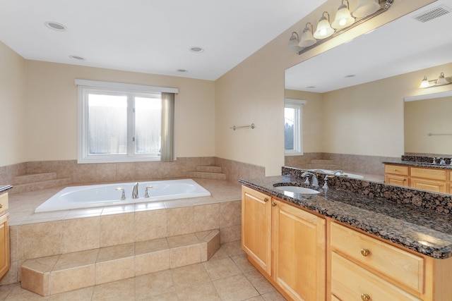 full bath featuring two vanities, visible vents, a sink, and tile patterned floors