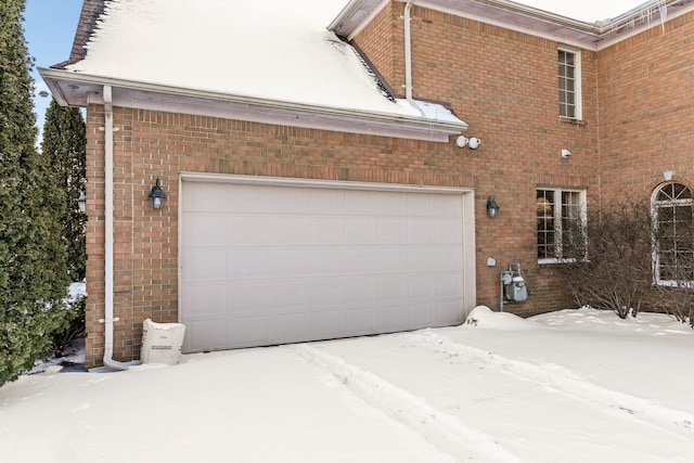 view of snow covered garage