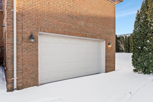 view of snow covered garage