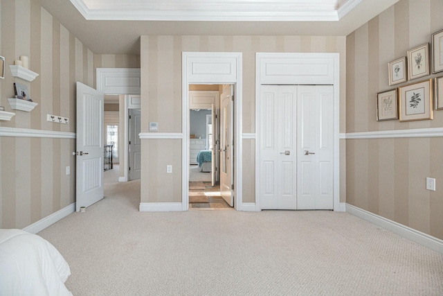 bedroom featuring ornamental molding, light colored carpet, and wallpapered walls