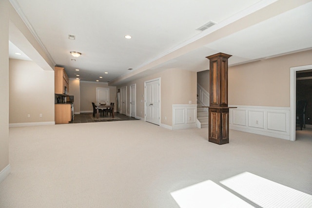 unfurnished living room with recessed lighting, carpet flooring, visible vents, stairs, and decorative columns