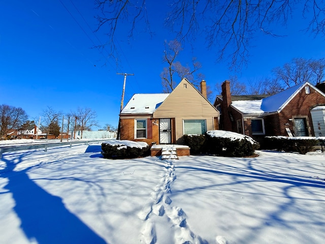 view of front of house featuring brick siding