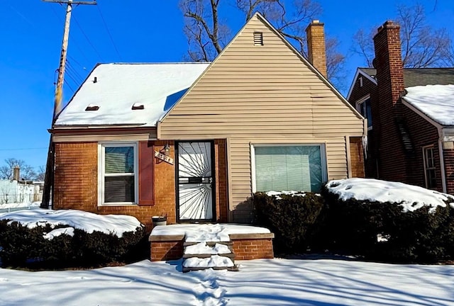 view of front of house featuring brick siding