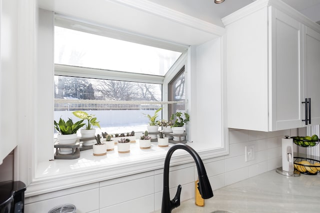 room details with light countertops and white cabinets