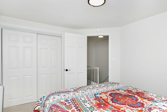 bedroom featuring a closet and carpet flooring