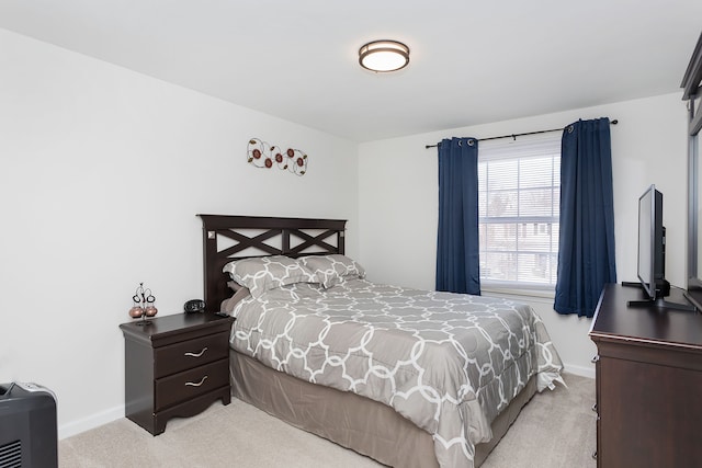 bedroom featuring baseboards and carpet flooring