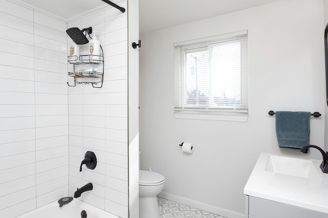 full bathroom with bathing tub / shower combination, toilet, vanity, baseboards, and tile patterned floors