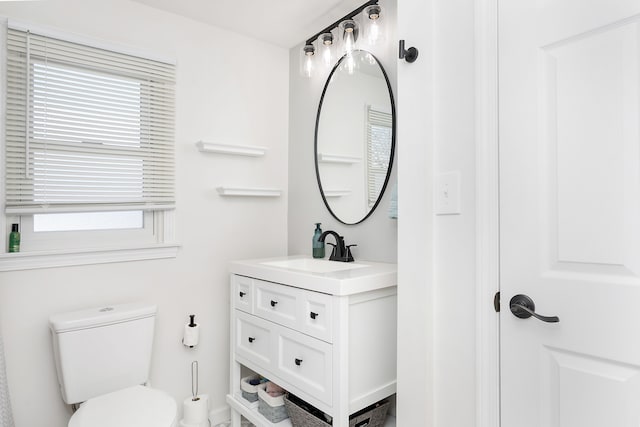 bathroom with toilet and vanity