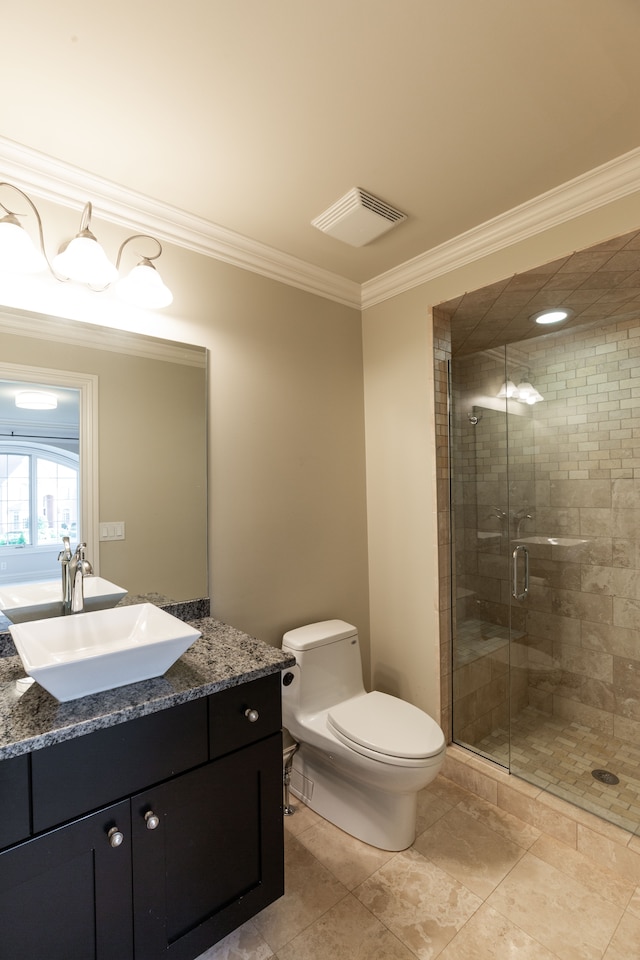 bathroom featuring a shower with shower door, vanity, crown molding, and toilet