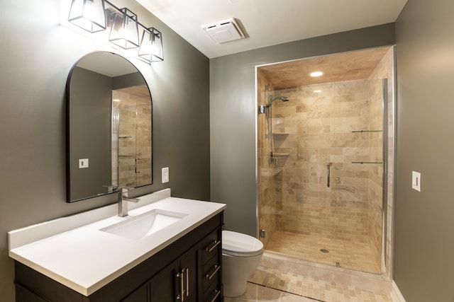 bathroom with vanity, toilet, and walk in shower