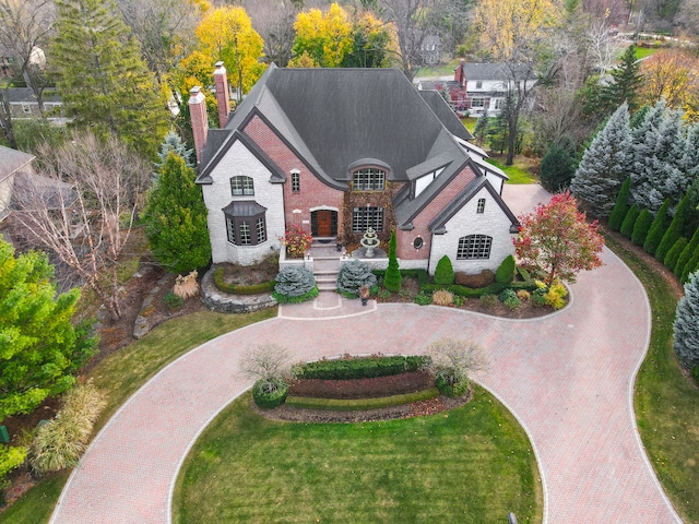 french country home with a front lawn