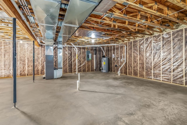 basement featuring water heater and heating unit