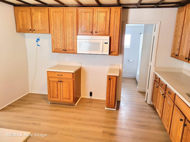 kitchen with light wood-type flooring