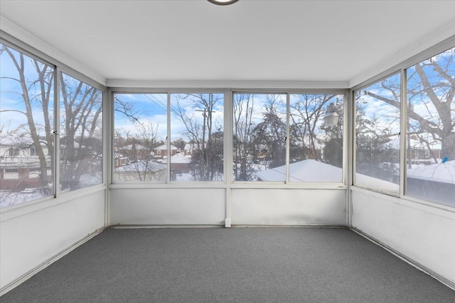 unfurnished sunroom featuring a wealth of natural light