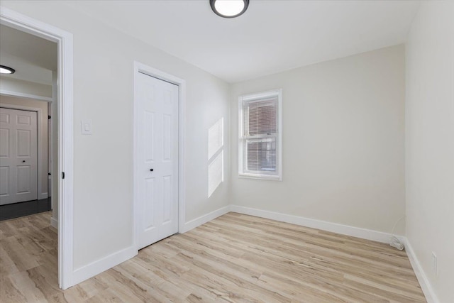 unfurnished room with light hardwood / wood-style flooring