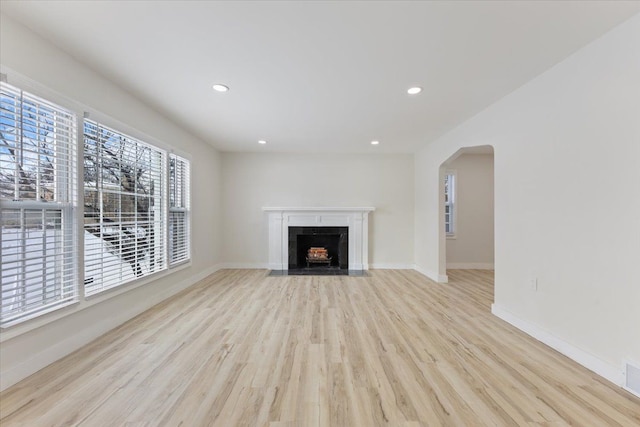 unfurnished living room with light hardwood / wood-style flooring