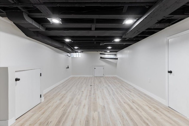 basement featuring light hardwood / wood-style flooring