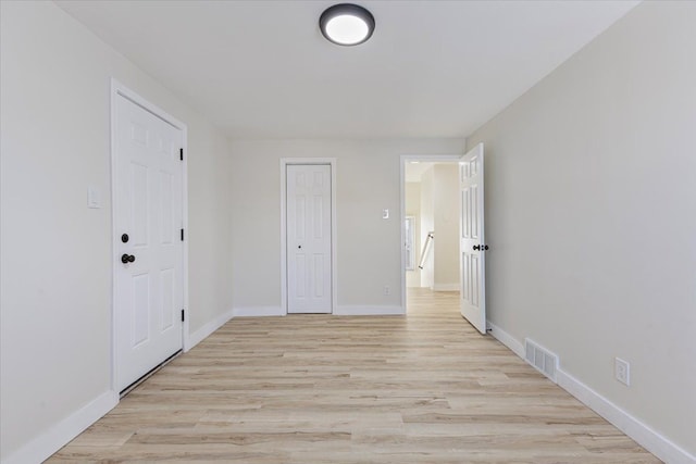 unfurnished bedroom featuring light hardwood / wood-style floors