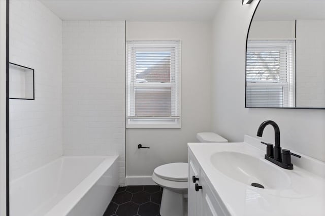 full bathroom with toilet, vanity, tile patterned flooring, and tiled shower / bath combo