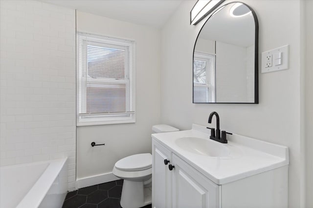 bathroom with toilet, vanity, and tile patterned flooring