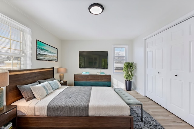 bedroom featuring a closet and light hardwood / wood-style flooring