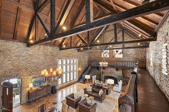 unfurnished living room with wooden ceiling, high vaulted ceiling, beam ceiling, and wood finished floors