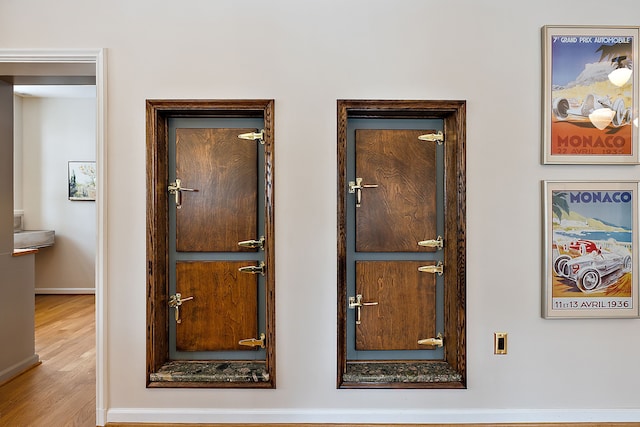 room details featuring baseboards and wood finished floors