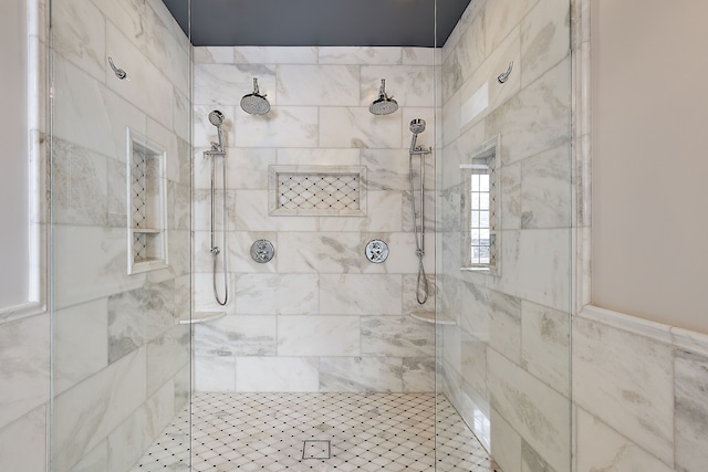 bathroom with tiled shower