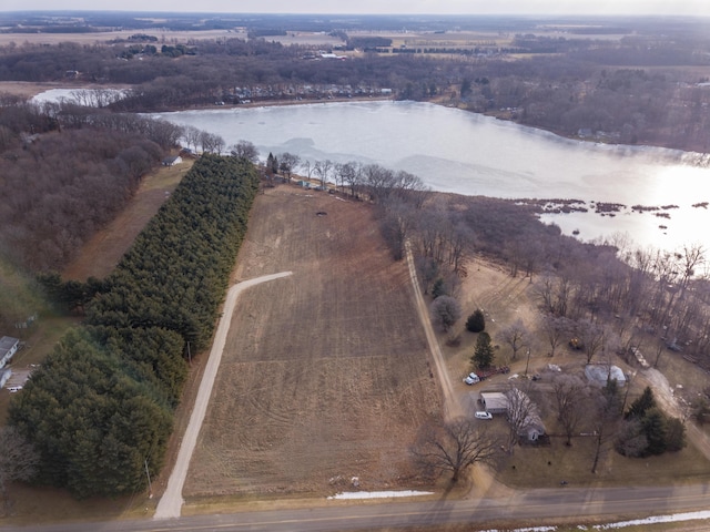 birds eye view of property with a rural view and a water view