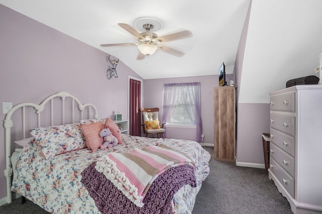 bedroom with ceiling fan, vaulted ceiling, and carpet floors