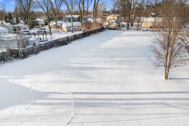 view of yard layered in snow