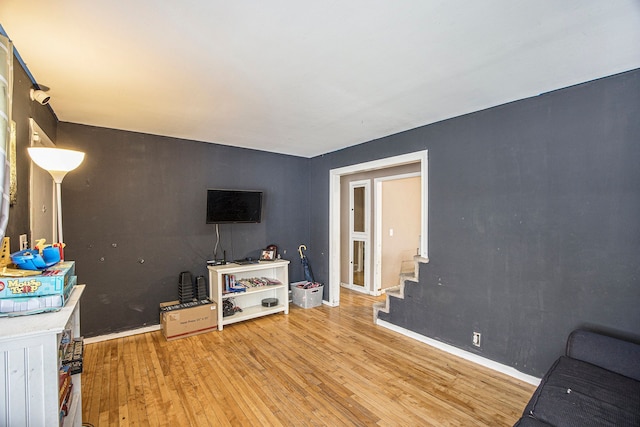 living room with light hardwood / wood-style flooring