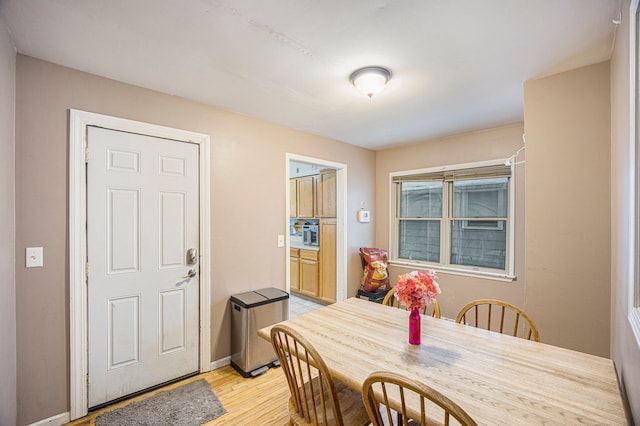 dining area with light wood-type flooring