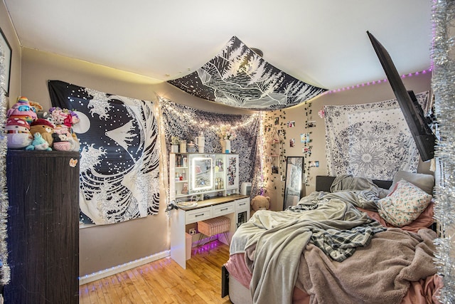 bedroom with light hardwood / wood-style flooring