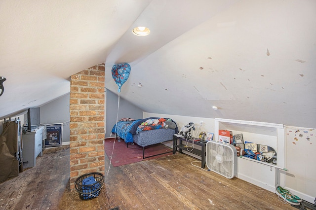 bedroom featuring dark wood-type flooring and vaulted ceiling