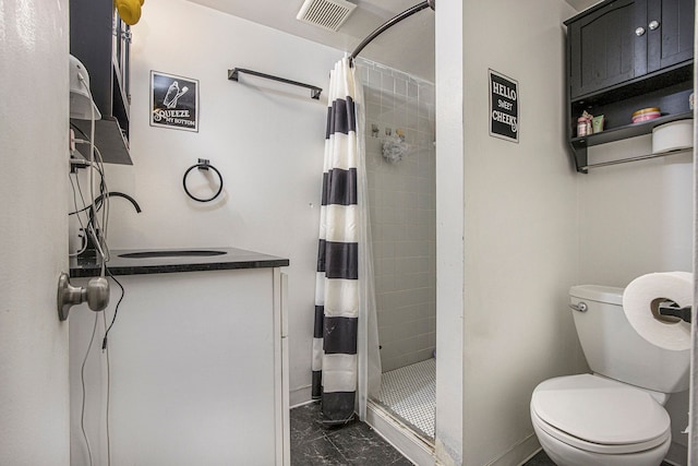 bathroom with toilet, vanity, and a shower with shower curtain