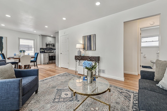 living room with light hardwood / wood-style floors