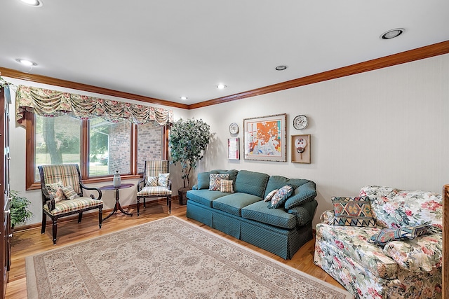 living room with ornamental molding, light wood-type flooring, baseboards, and recessed lighting