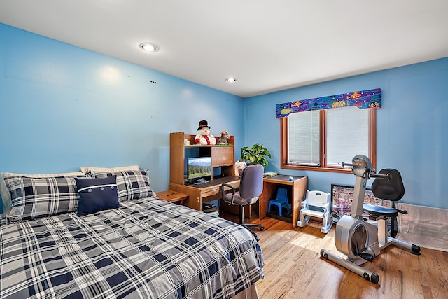 bedroom featuring wood finished floors